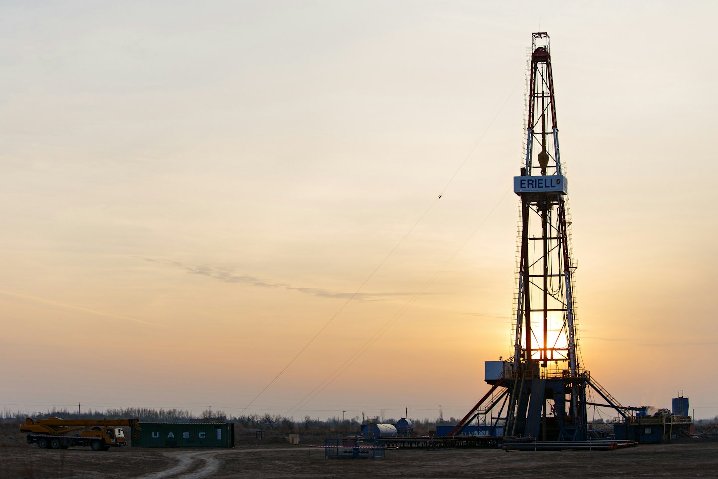 Drilling rig at sunset